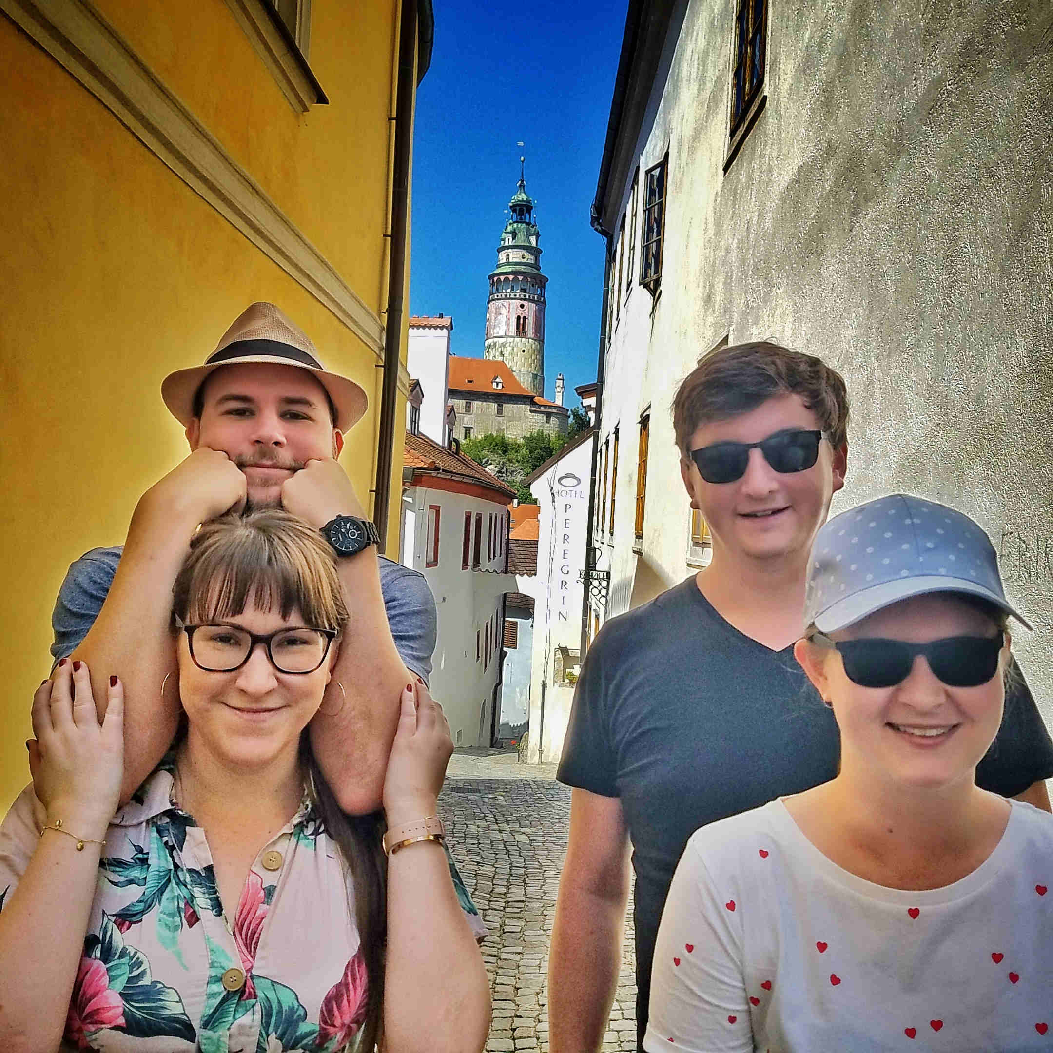 Tourists in front of Český Krumlov castle tower in Masna street